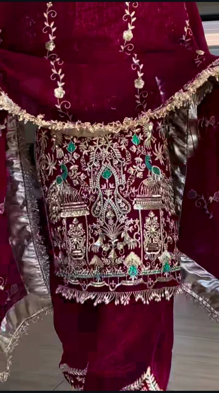 Maroon saree with intricate silver and green embroidery
