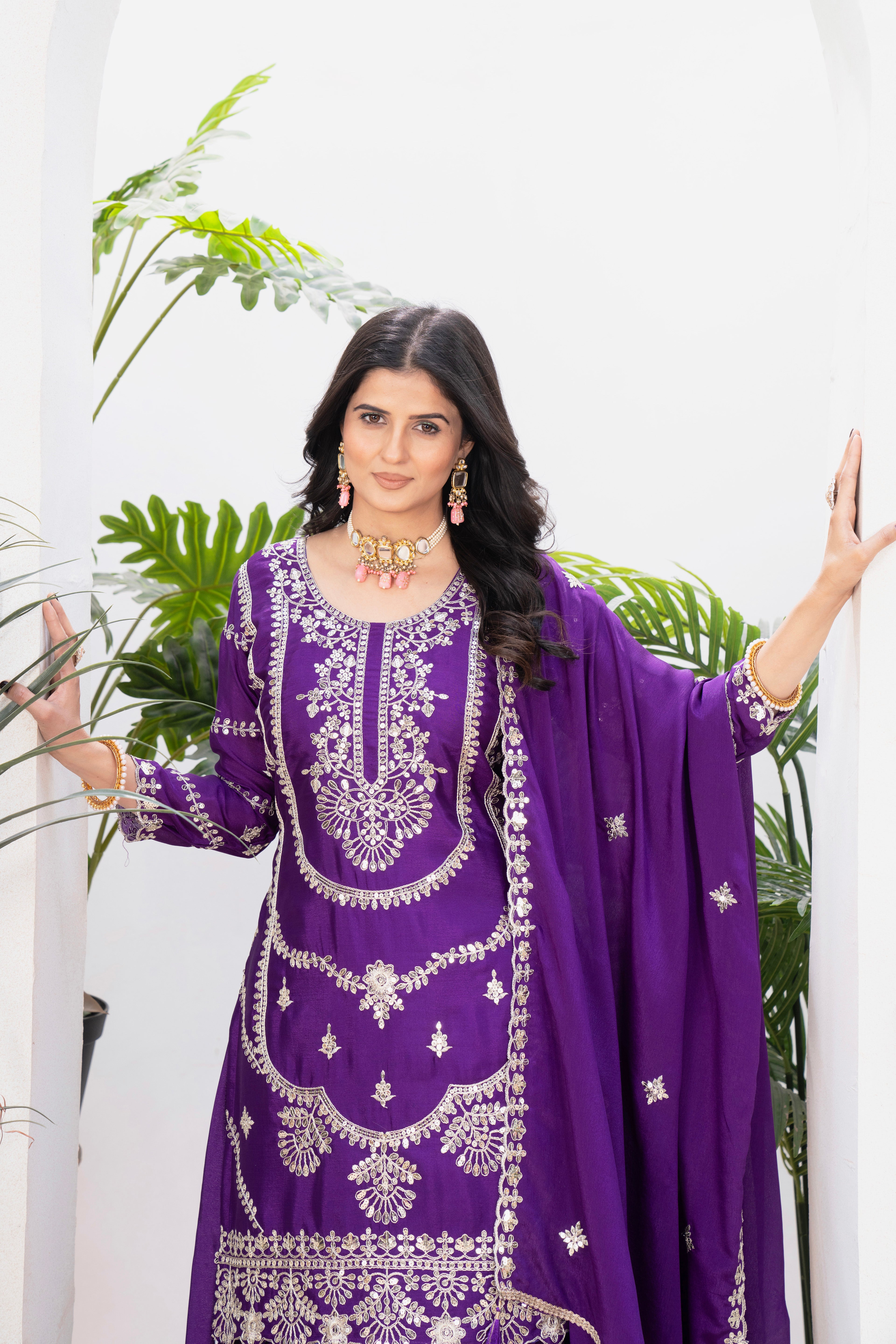 Embrace sophistication in this exquisite purple lehenga sharara suit, which combines classic design elements with modern flair.