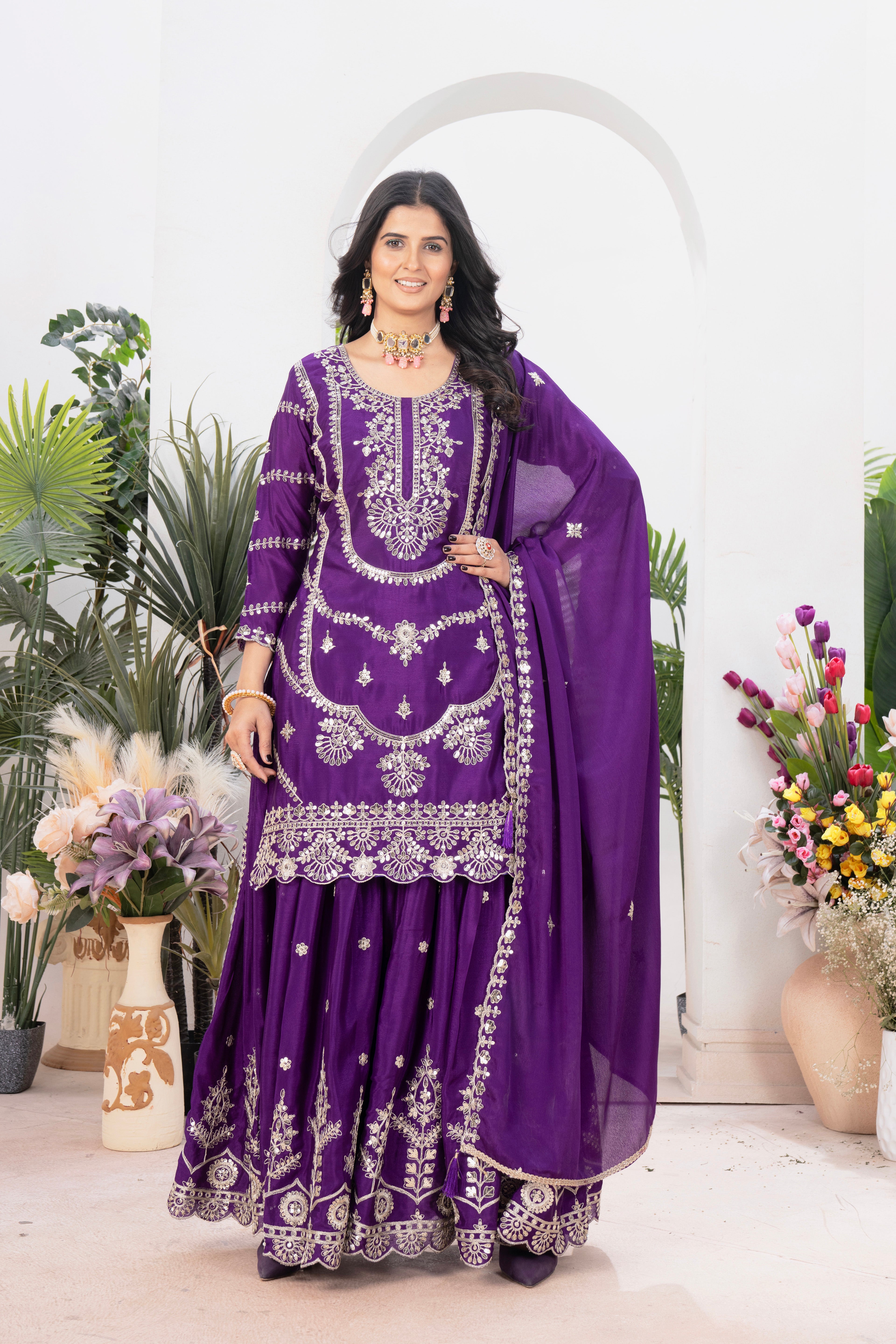 Embrace sophistication in this exquisite purple lehenga sharara suit, which combines classic design elements with modern flair.