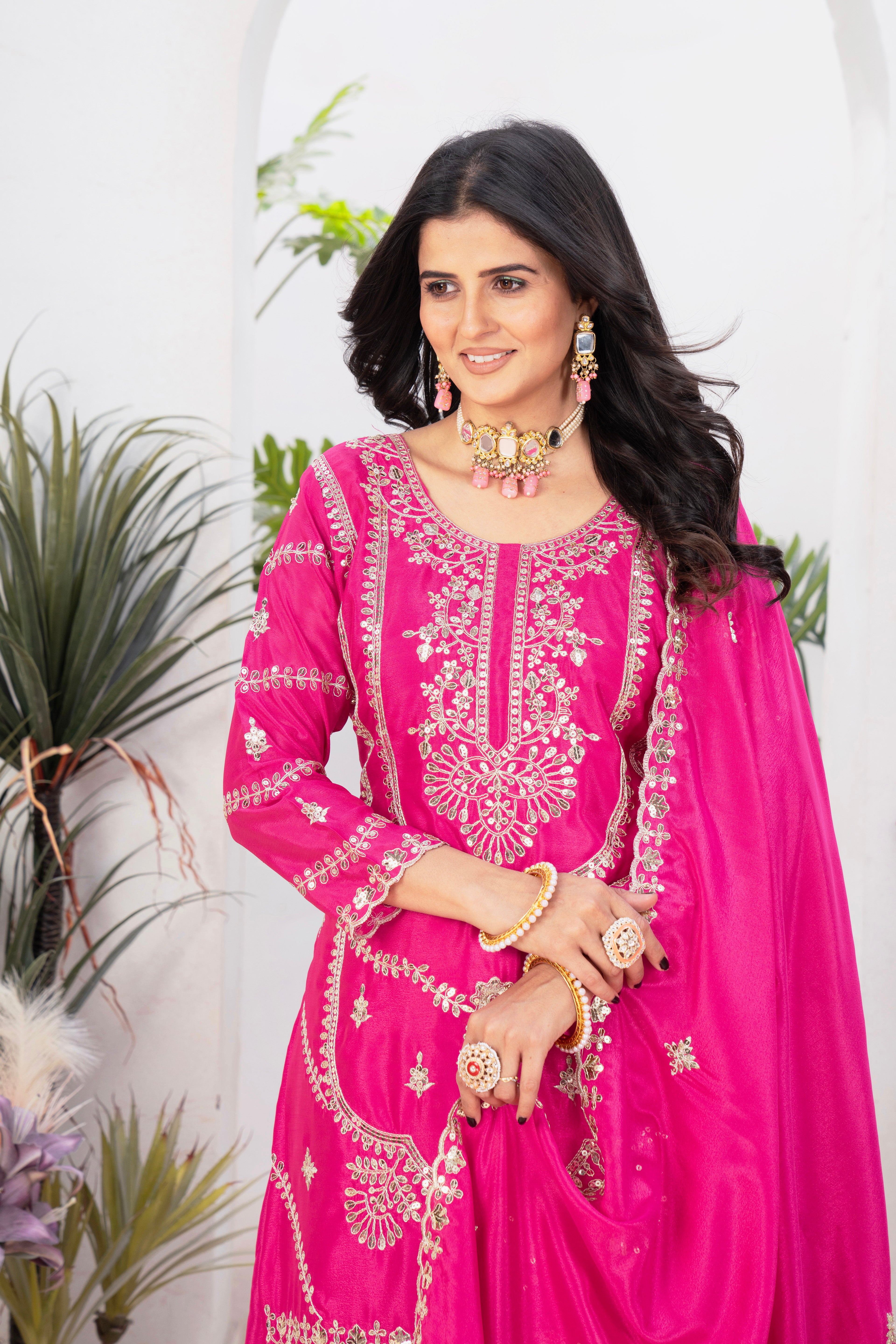 With this gorgeous pink lehenga sharara outfit, which combines tradition and modern flair, you may step into elegance.