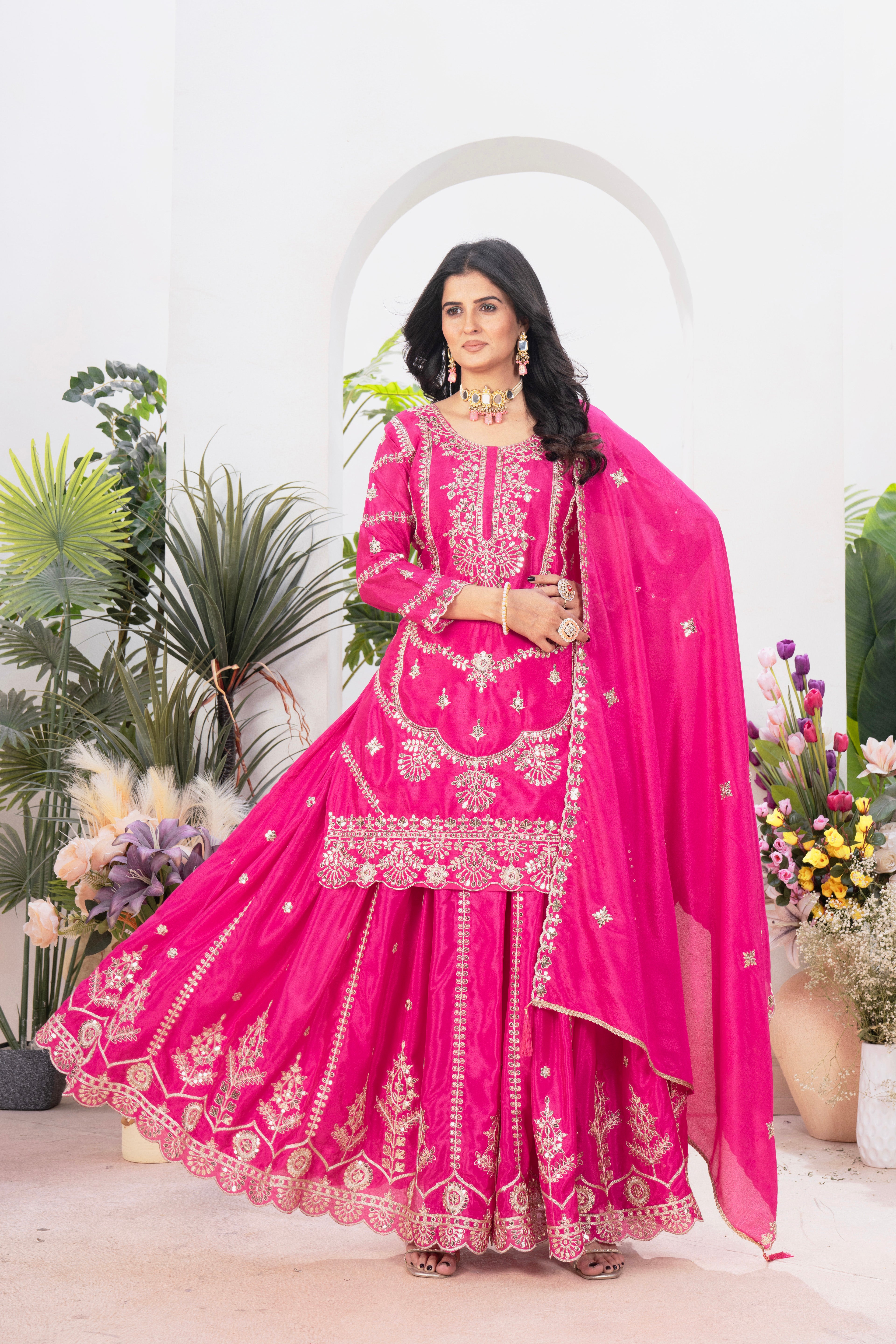 With this gorgeous pink lehenga sharara outfit, which combines tradition and modern flair, you may step into elegance.