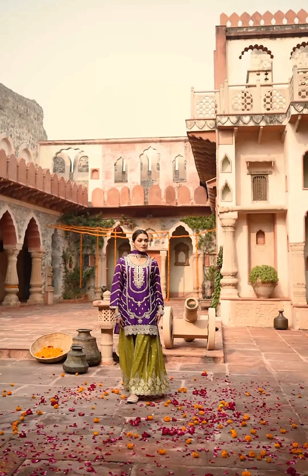 An exquisite purple-yellow Sharara suit that is ideal for this festive season