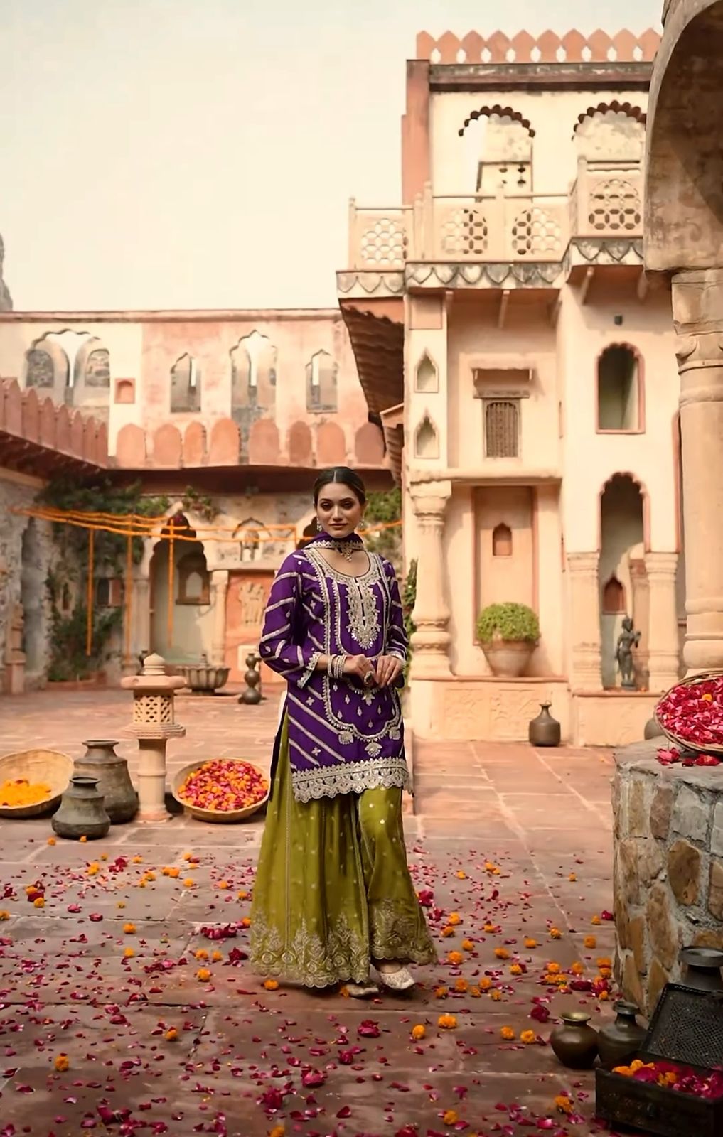 An exquisite purple-yellow Sharara suit that is ideal for this festive season