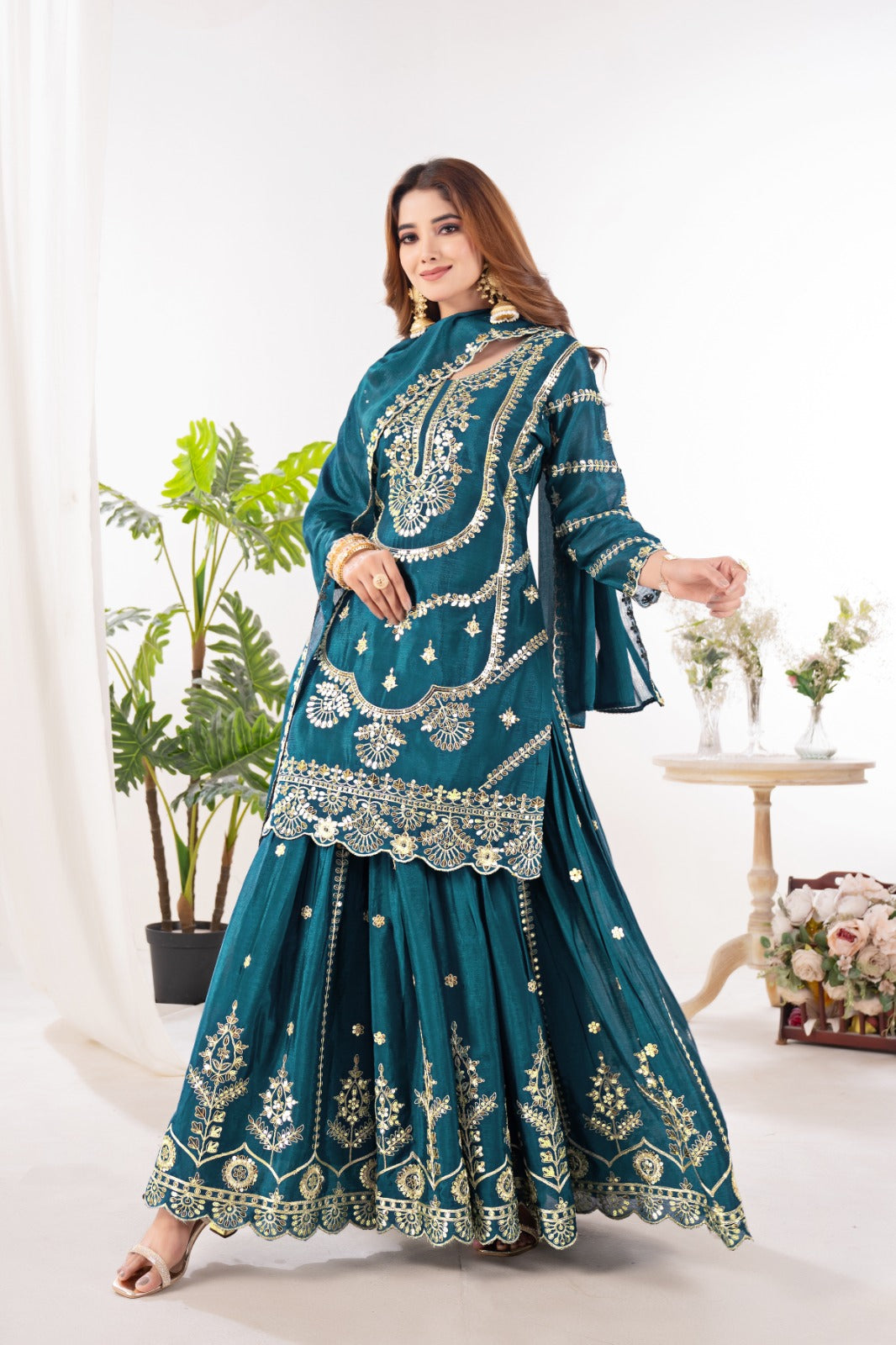 Embrace sophistication in this exquisite purple lehenga sharara suit, which combines classic design elements with modern flair.