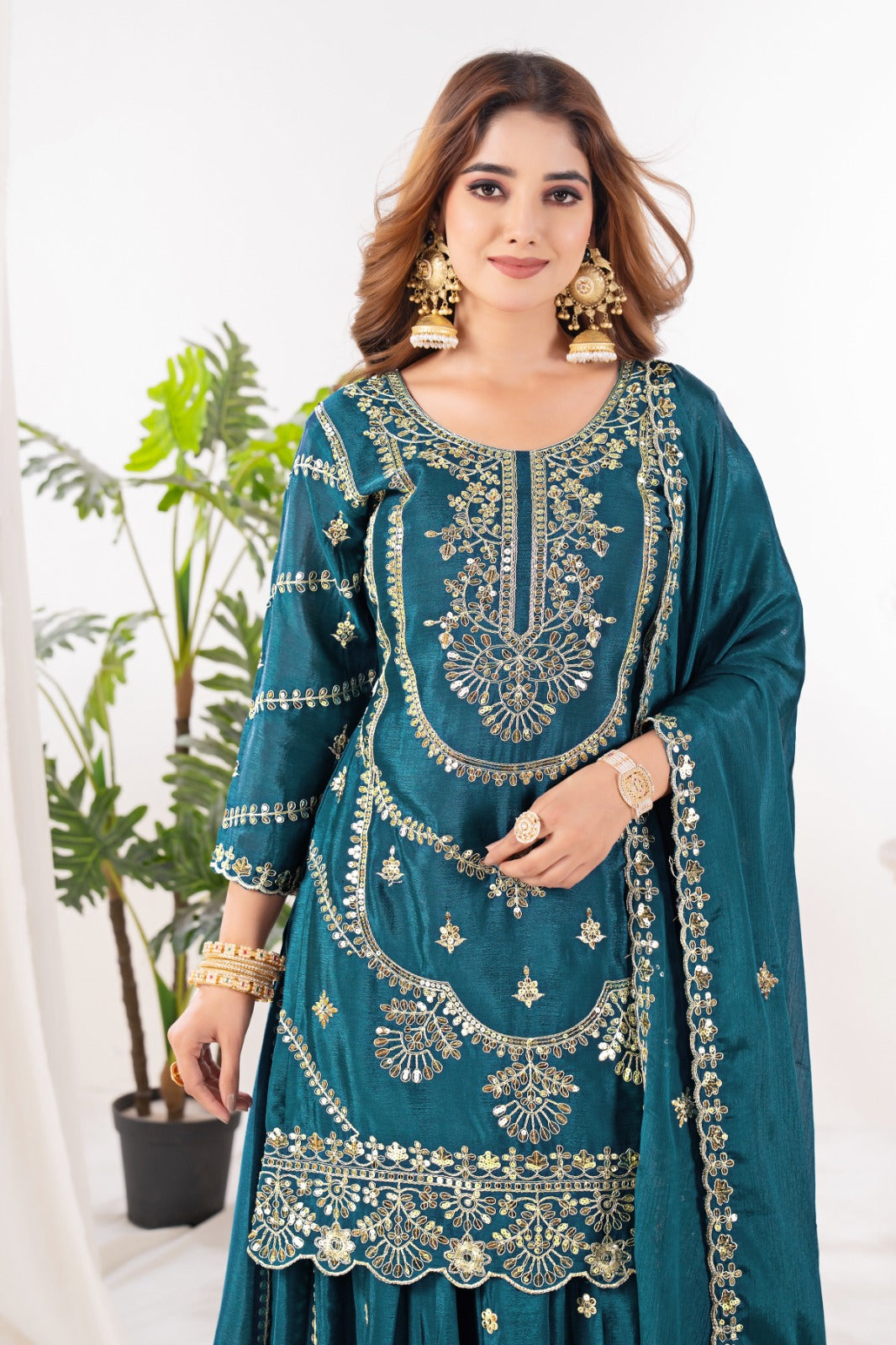 Embrace sophistication in this exquisite purple lehenga sharara suit, which combines classic design elements with modern flair.