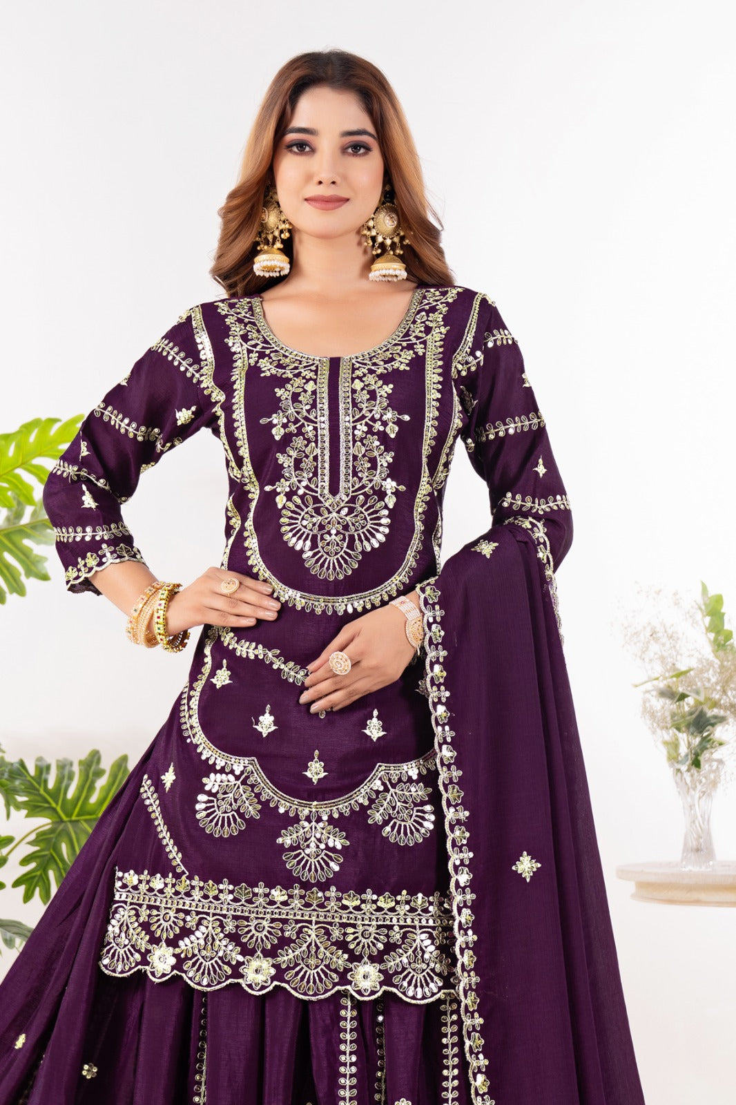 Embrace sophistication in this exquisite purple lehenga sharara suit, which combines classic design elements with modern flair.