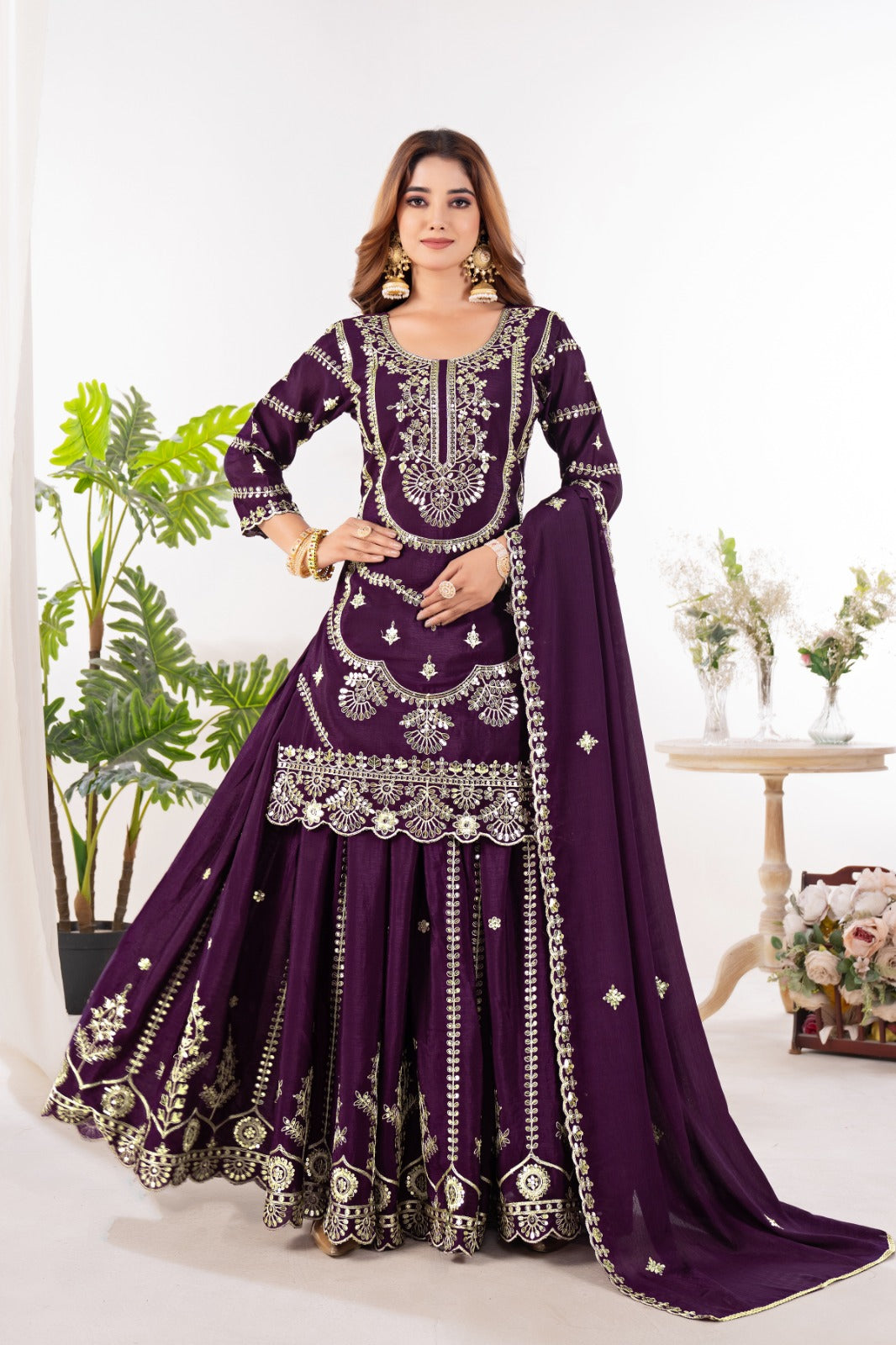 Embrace sophistication in this exquisite purple lehenga sharara suit, which combines classic design elements with modern flair.