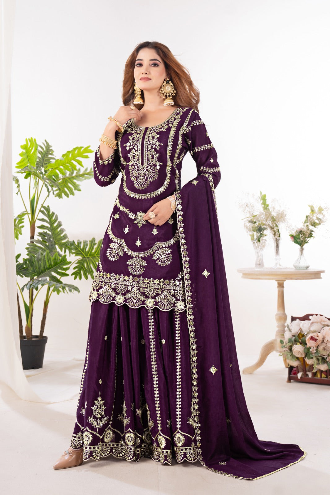 Embrace sophistication in this exquisite purple lehenga sharara suit, which combines classic design elements with modern flair.