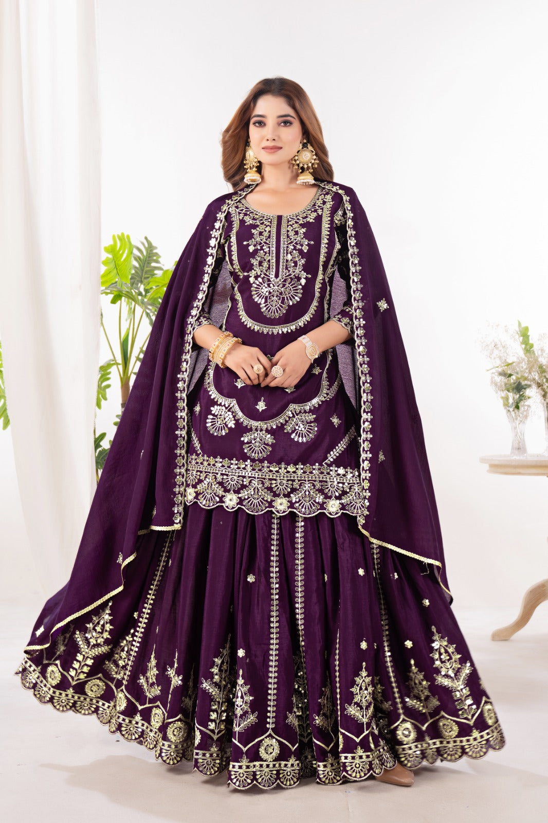 Embrace sophistication in this exquisite purple lehenga sharara suit, which combines classic design elements with modern flair.