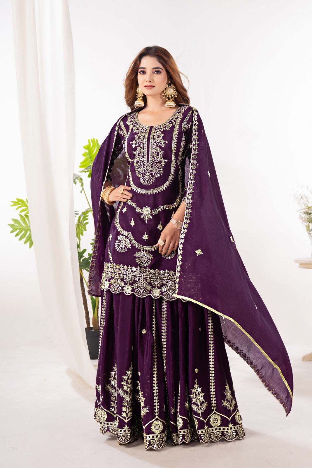 Embrace sophistication in this exquisite purple lehenga sharara suit, which combines classic design elements with modern flair.