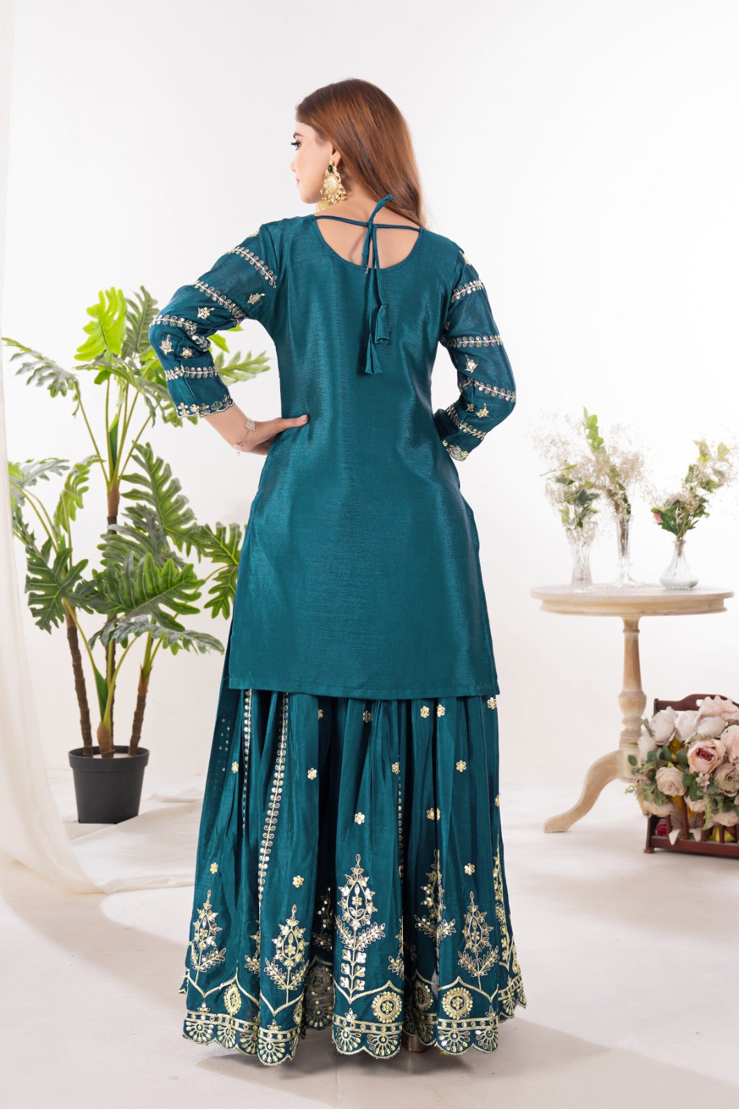 Embrace sophistication in this exquisite purple lehenga sharara suit, which combines classic design elements with modern flair.