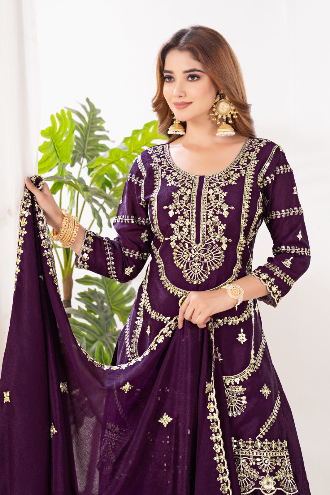 Embrace sophistication in this exquisite purple lehenga sharara suit, which combines classic design elements with modern flair.