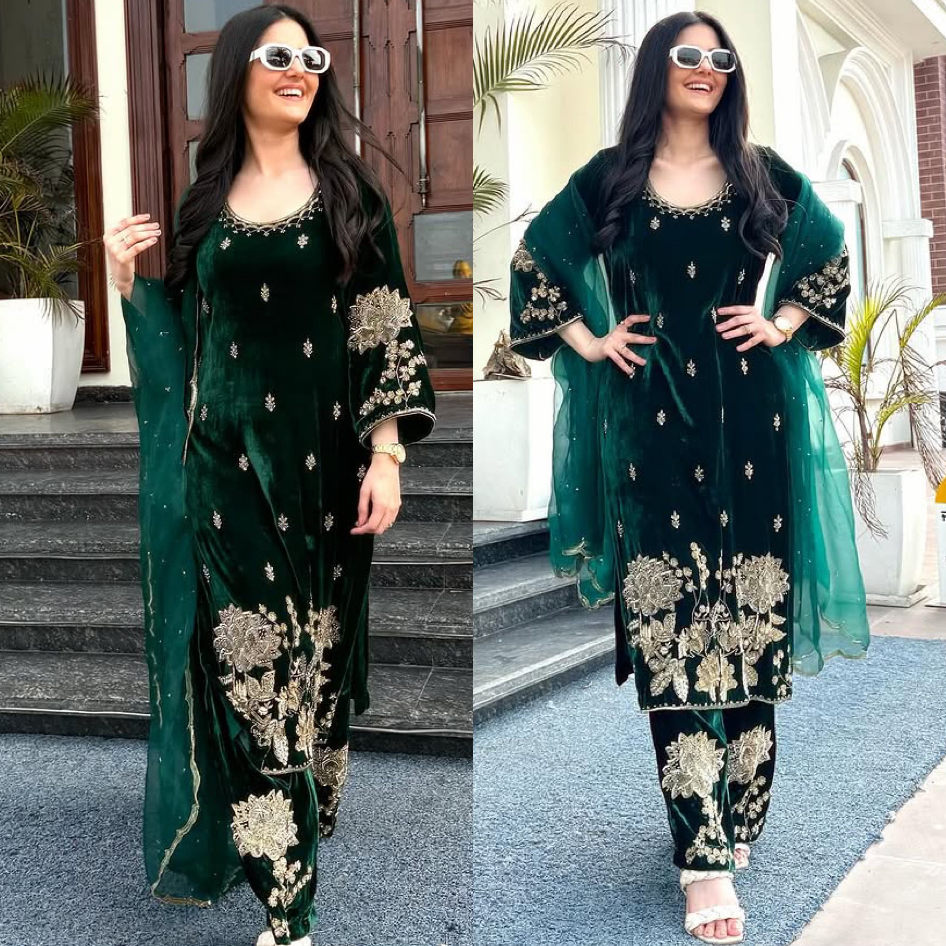 A woman wearing a traditional green velvet suit with embroidery and sequins, posing on stairs with a building and potted plants in the background.