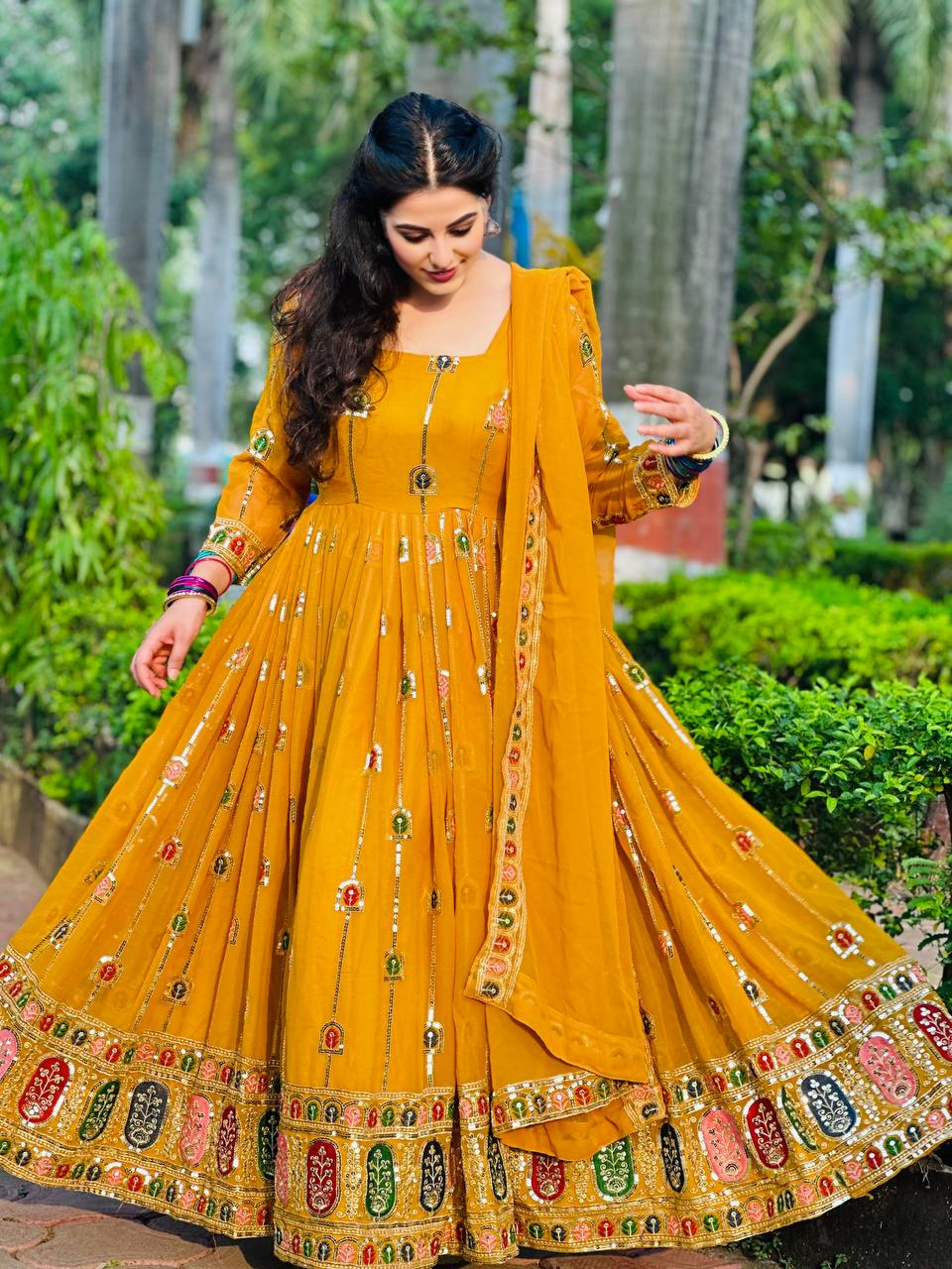 Shine bright with our vivid yellow Anarkali gown, which is the ideal fusion of classic style, sophistication, and contemporary function charm.