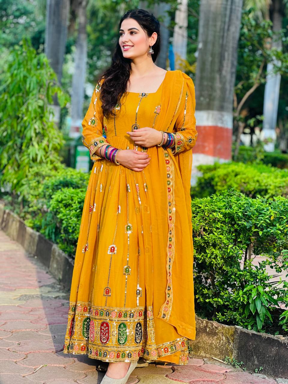 Shine bright with our vivid yellow Anarkali gown, which is the ideal fusion of classic style, sophistication, and contemporary function charm.