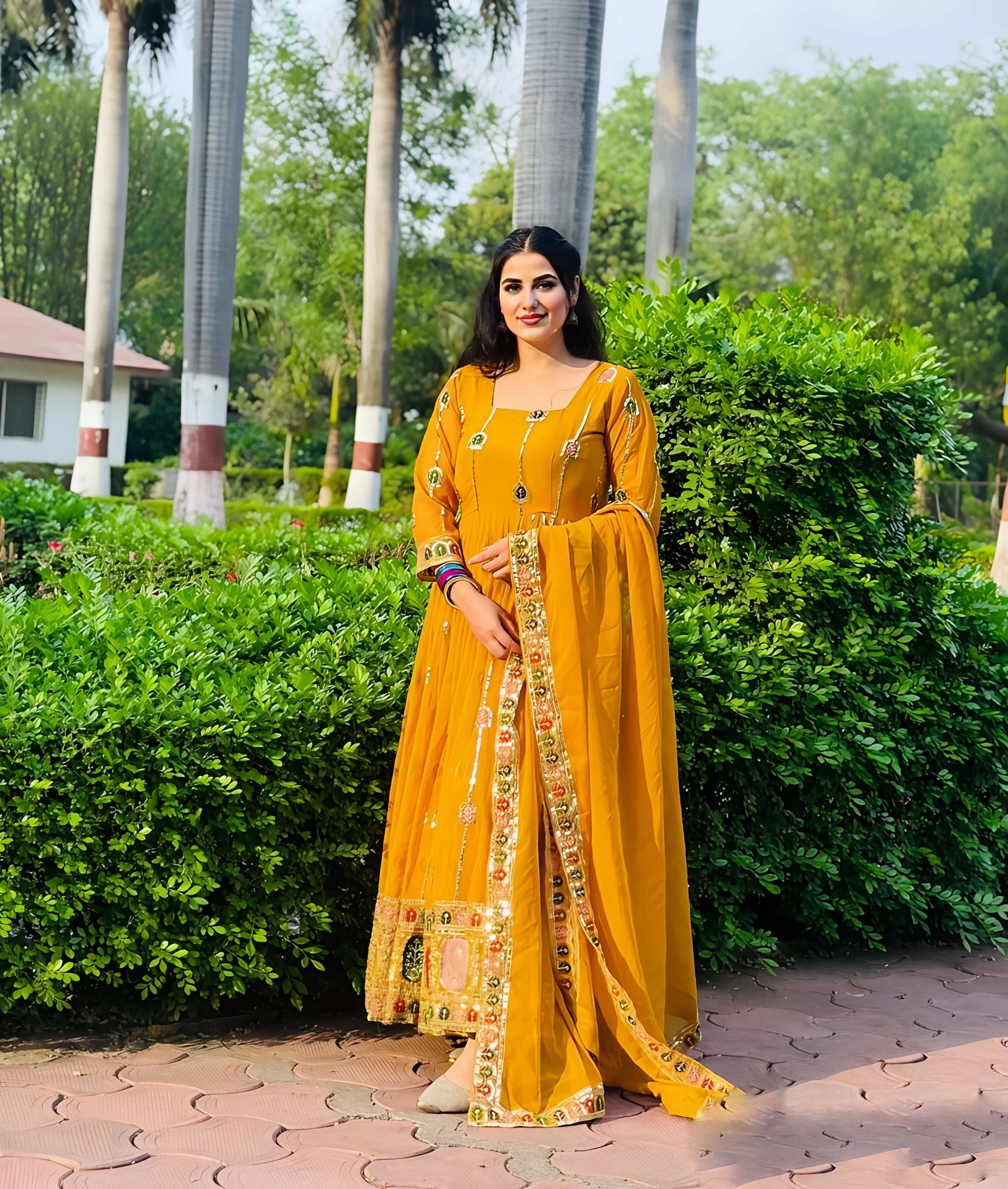Shine bright with our vivid yellow Anarkali gown, which is the ideal fusion of classic style, sophistication, and contemporary function charm.