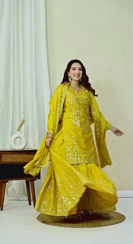 Model wearing designer stitched sharara suit for festive occasions