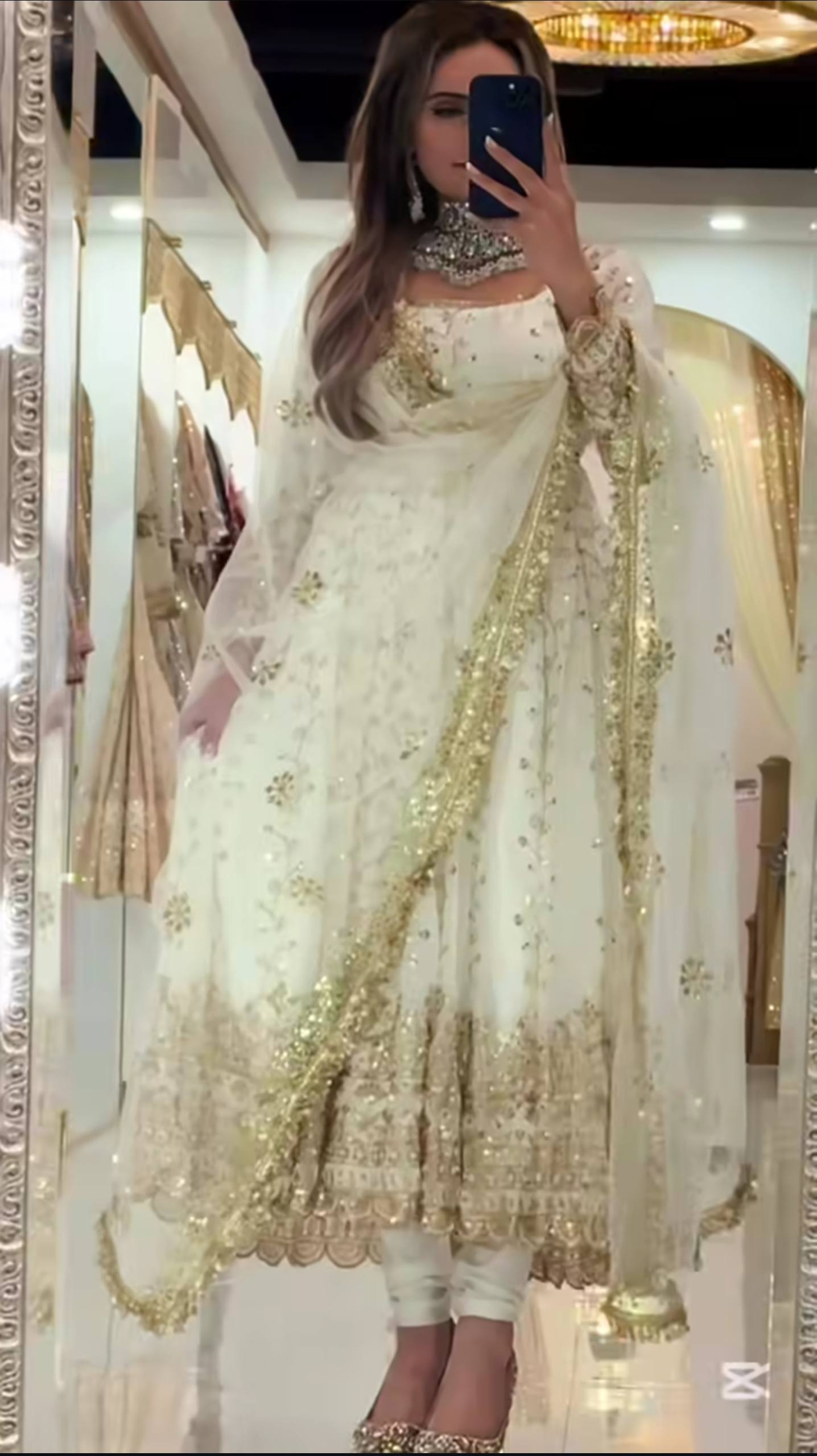 White embroidered anarkali suit with golden handwork and net dupatta for wedding wear