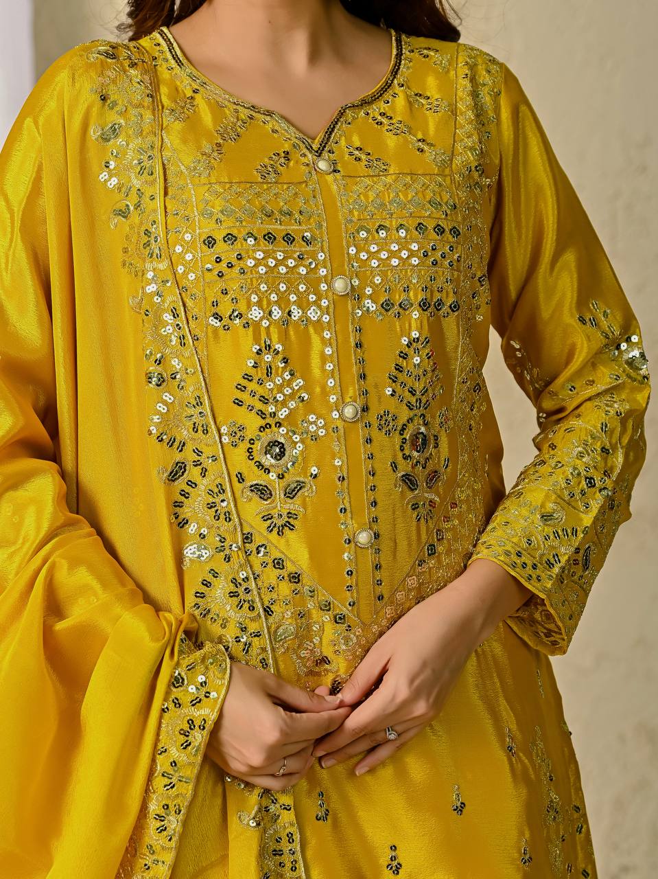 Close-up of sequin and mirror work on yellow sharara palazzo set

